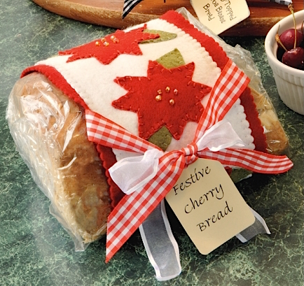 festive cherry bread recipe with poinsettia gift wrap